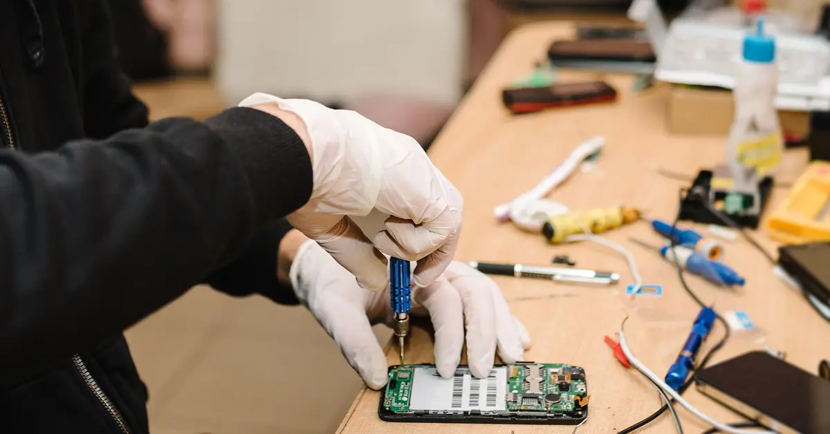 Worker repairing mobile systems